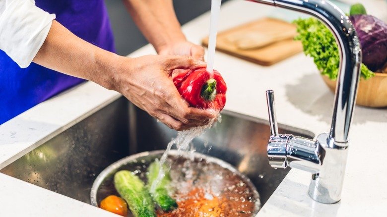 portrait,of,man,chef,cooking,and,preparing,wash,fresh,vegetables
